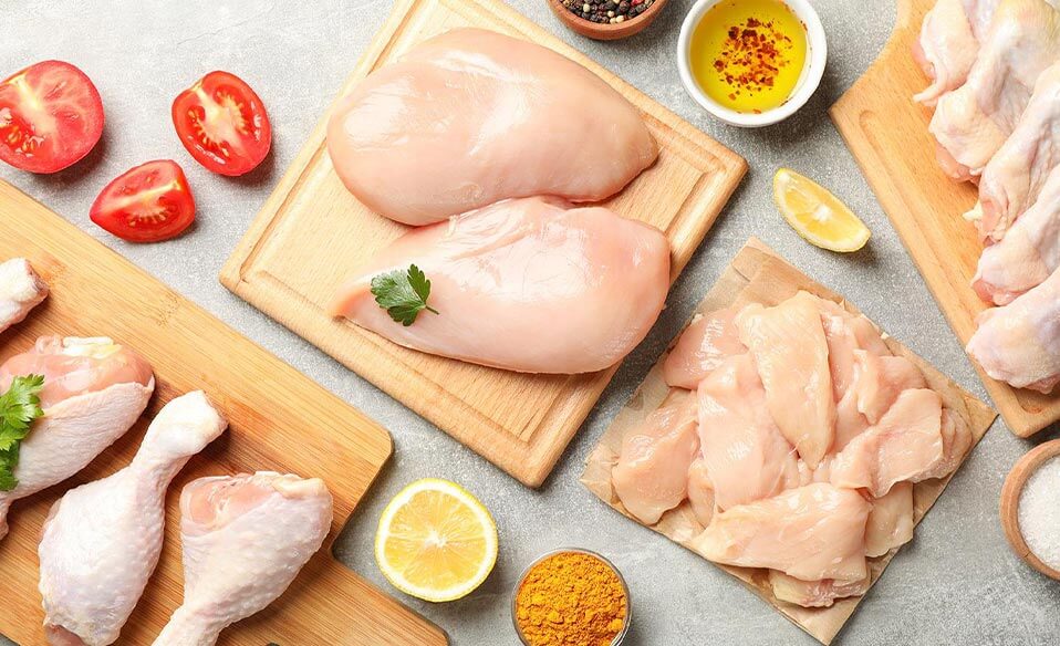 An image of fresh chicken on wooden board